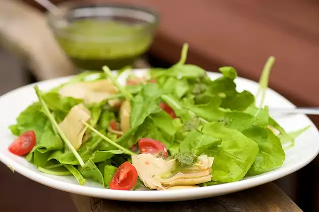 Arugula, Artichoke and Cherry Tomato  Salad with Pesto Vinaigrette